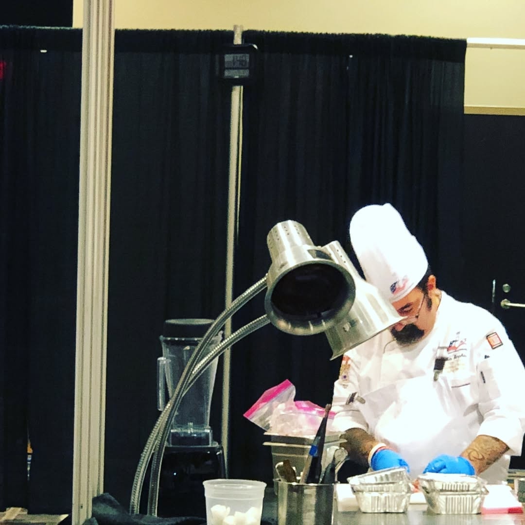 Ben Simpkins competing at a culinary event