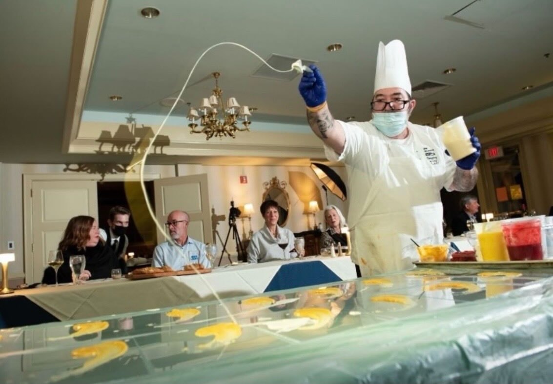 Chef Ben Simpkins performing a culinary demonstration